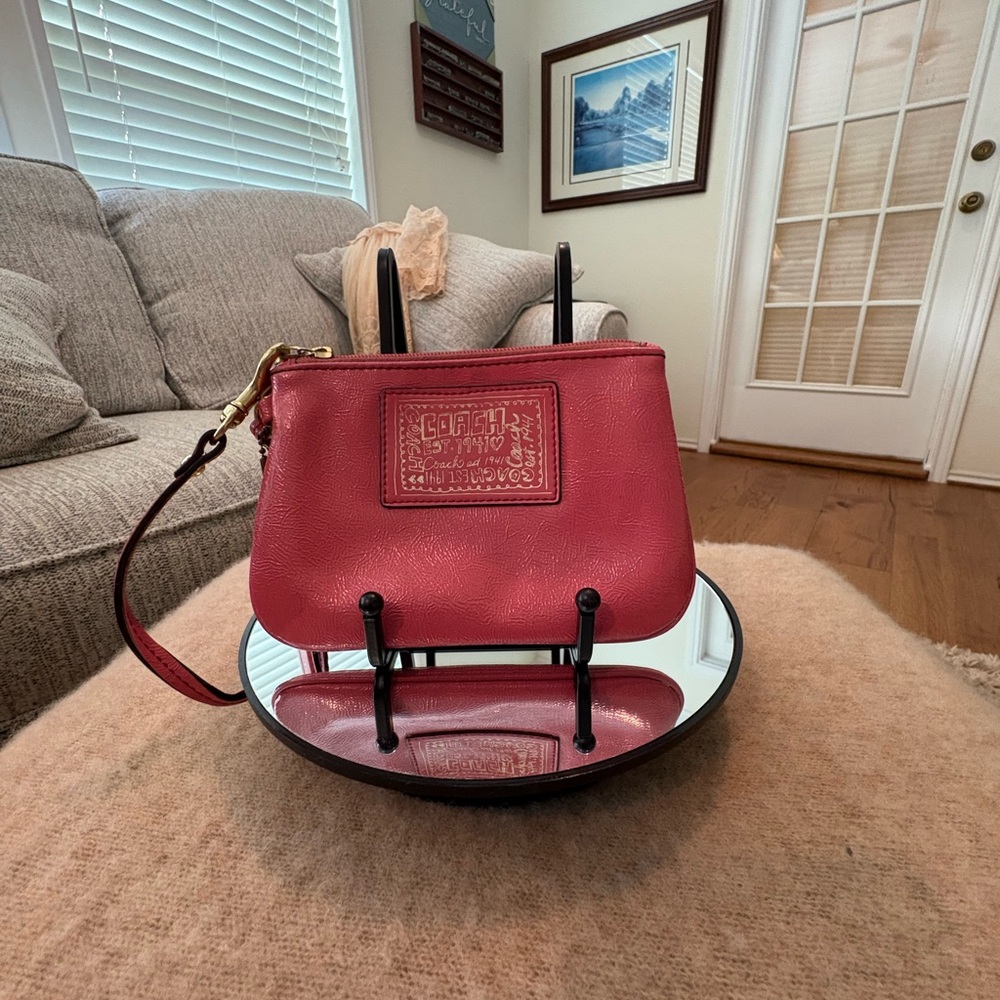 Coach Poppy Pink Leather Wristlet. 6”W by 4”L.